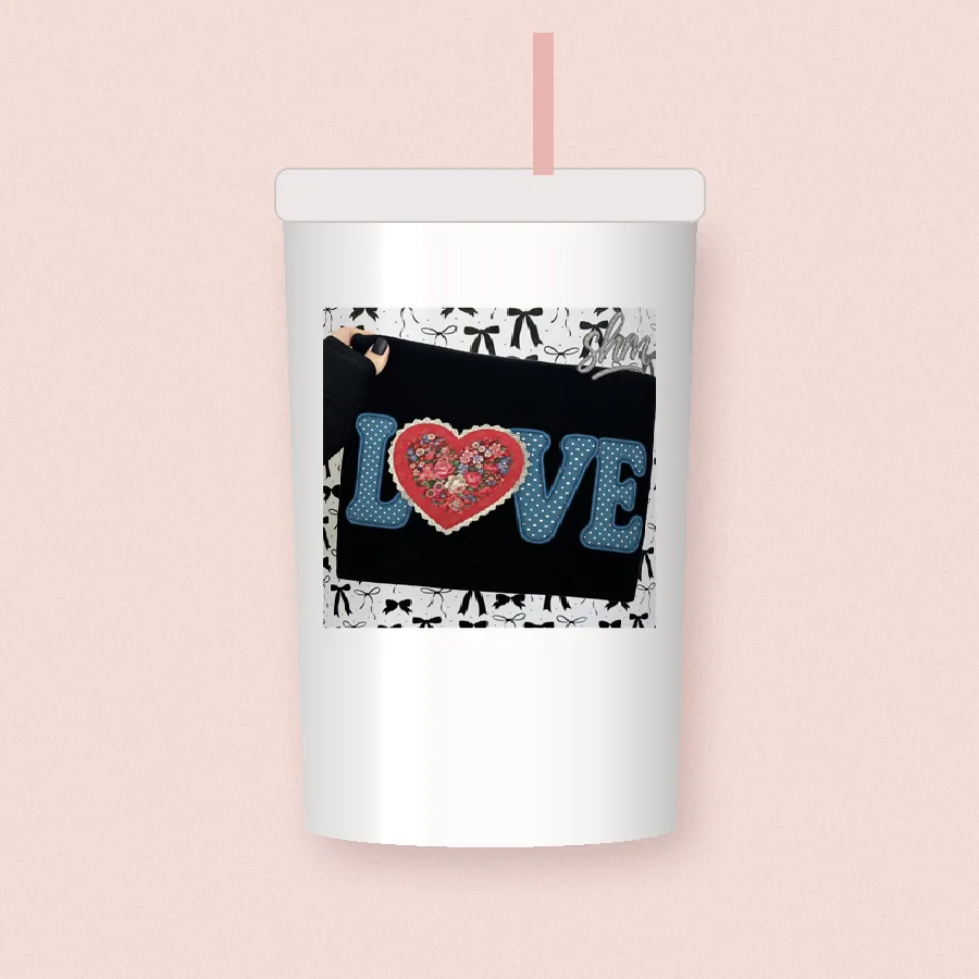 Faux Stitch Love sublimation design on a skinny tumbler