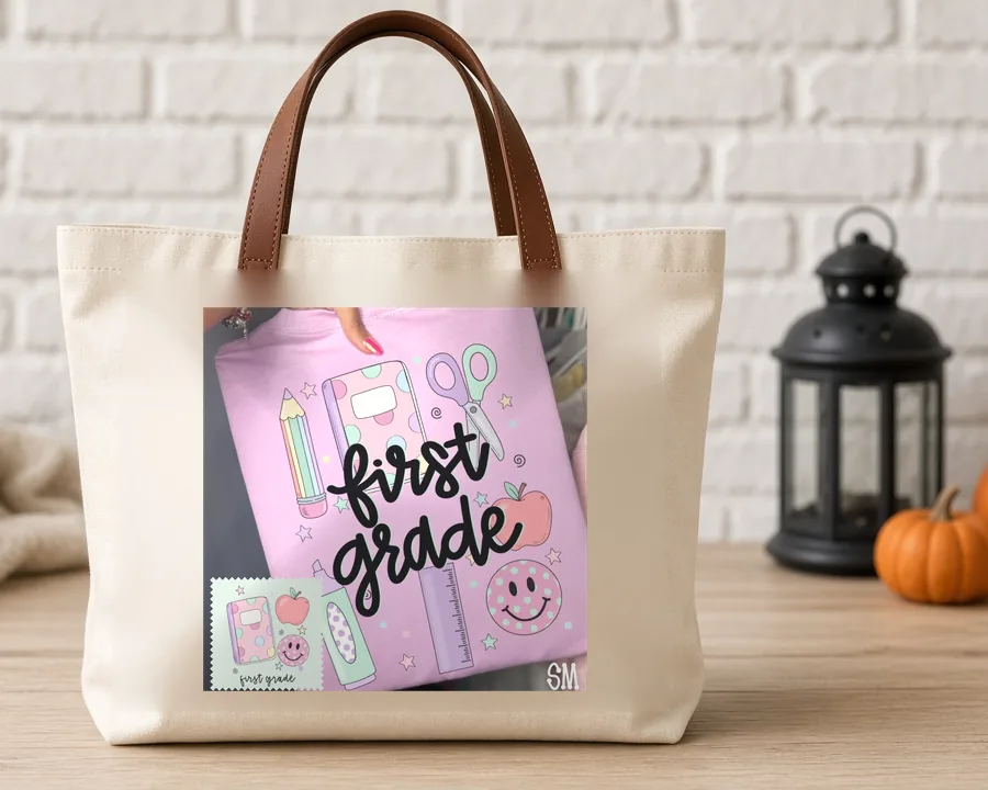 First Grade Teacher Doodles PNG design on a canvas tote bag