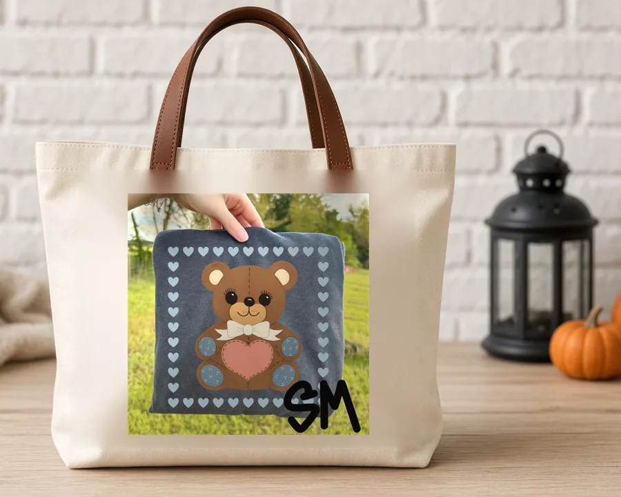Quilted Teddy Bear Hearts PNG design on a canvas tote bag