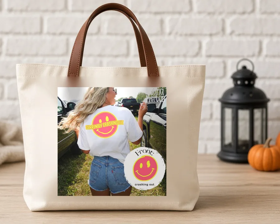 Smiley Front Pocket PNG design on a canvas tote bag