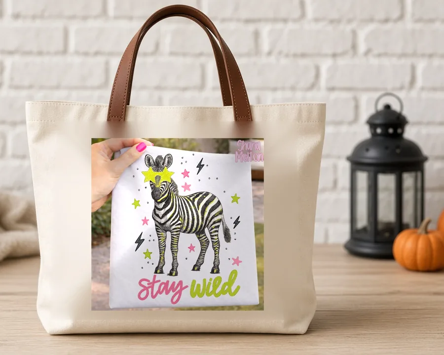 Stay Wild Zebra PNG design on a canvas tote bag